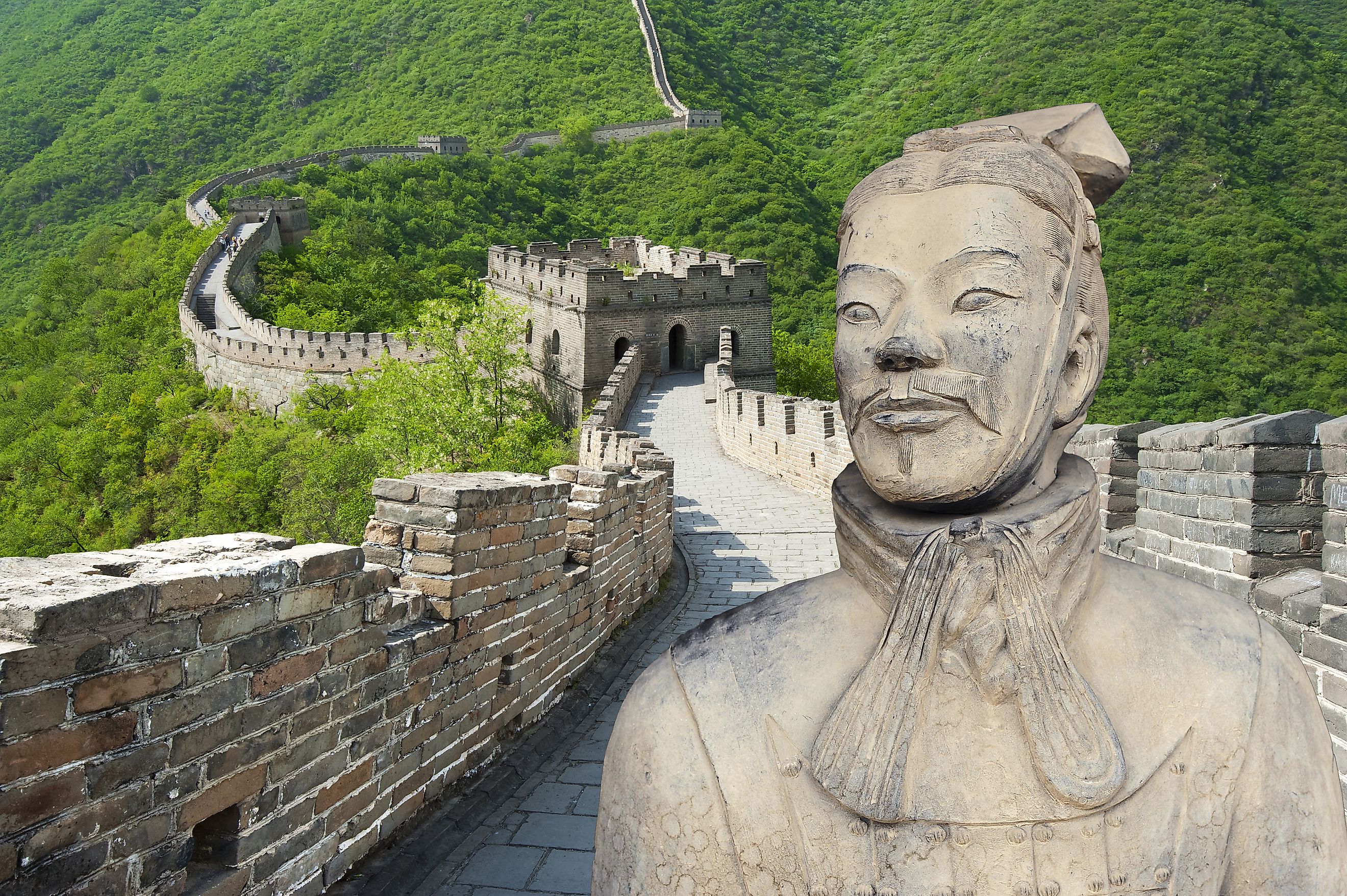 Ancient Chinese terracotta warrior against the Great Wall of China background