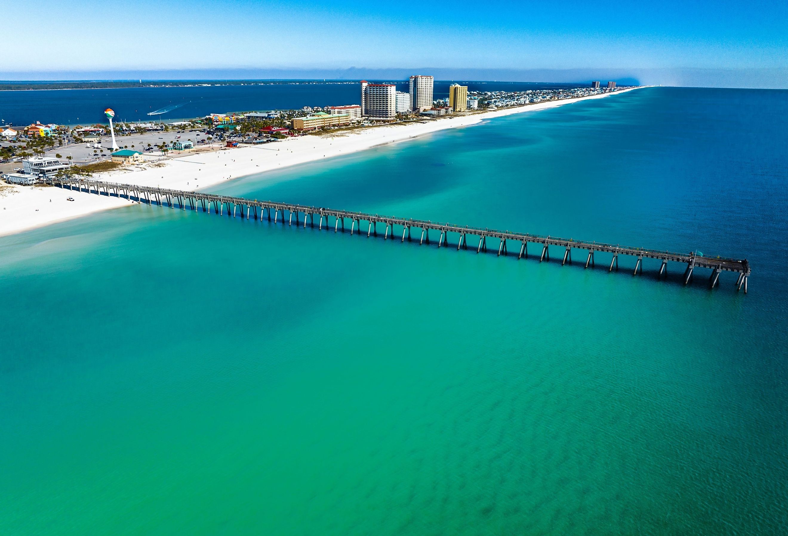 Aerial view of Pensacola Beach and its pier. Image credit Curt Cormier via Shutterstock.