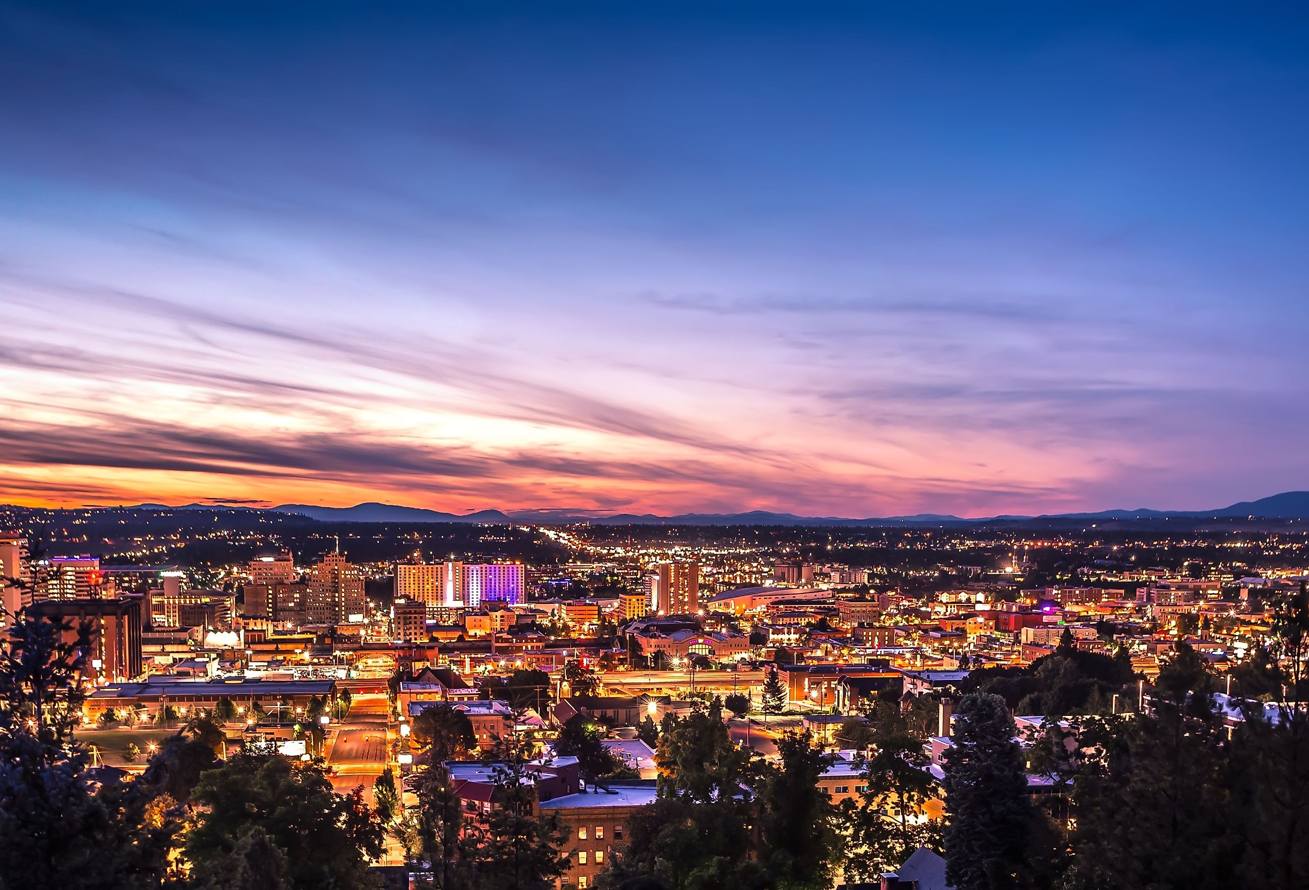 Panoramic view of Spokane, Washington's skyline at dusk.