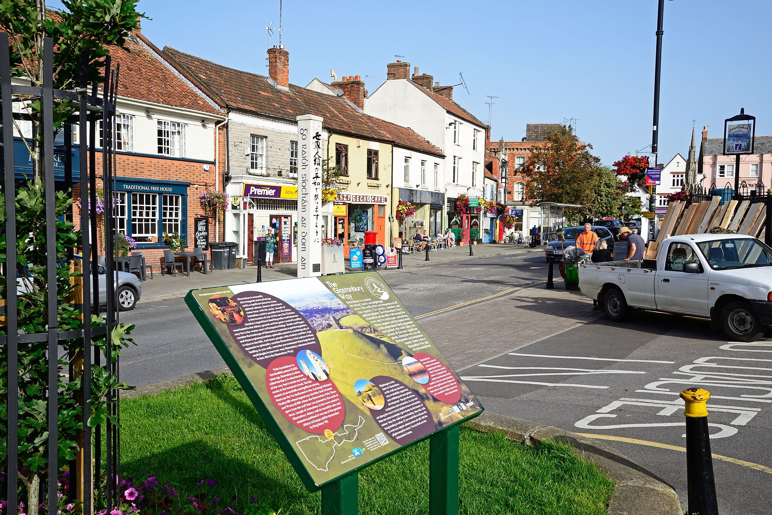 The Glastonbury Way information sign along Magdalene Street with town shops to the rear, Glastonbury, UK, via Caron Badkin / Shutterstock.com