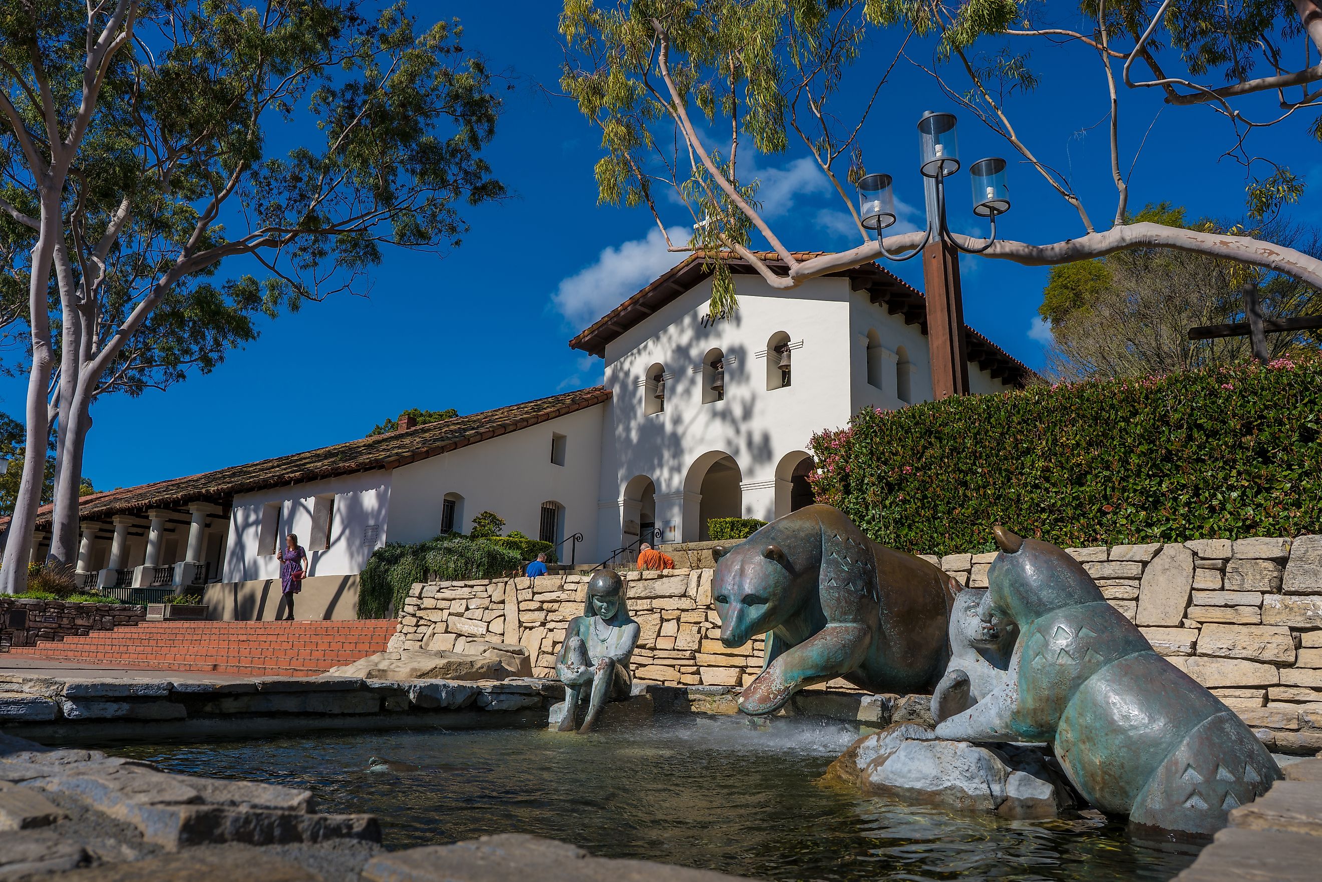 A fountain with statues of animals and a girl at a monastery in downtown San Luis Obispo, California. Editorial credit: shuttersv / Shutterstock.com