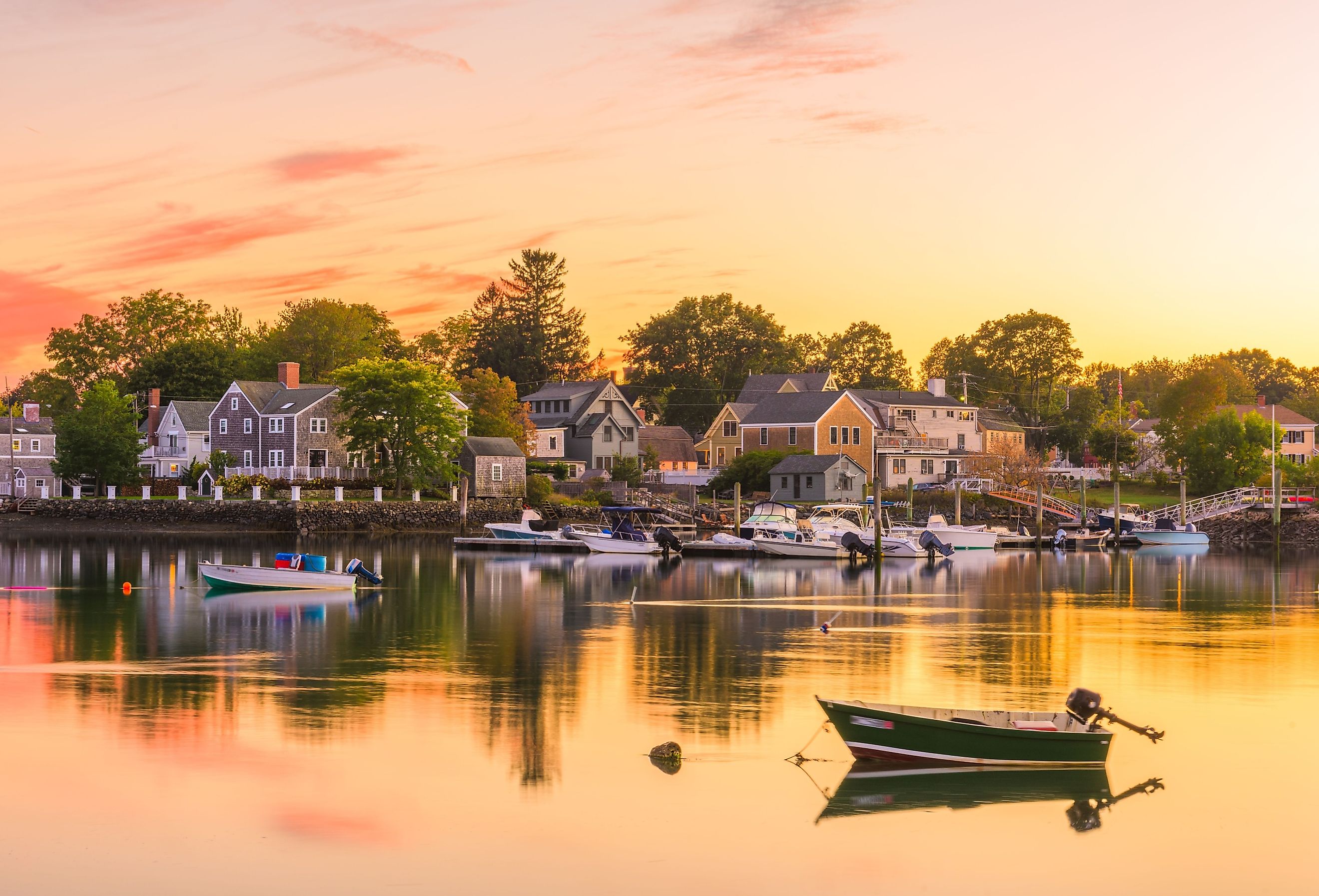 Portsmouth, New Hampshire, USA townscape with fishing boat at sunrise.