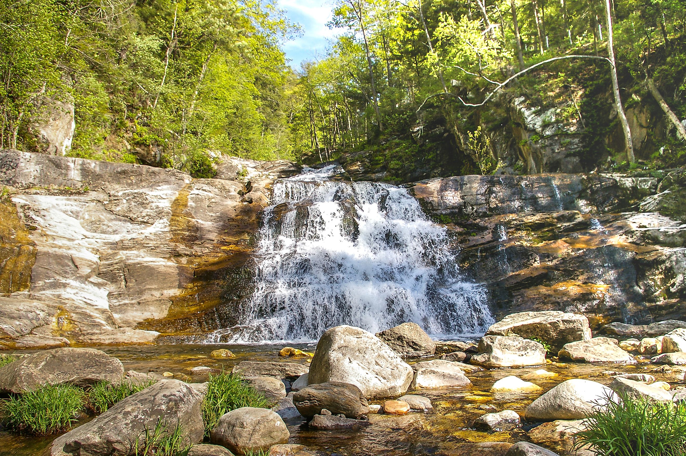 Beautiful waterfall cascading over rocks surrounded by lush greenery in Connecticut