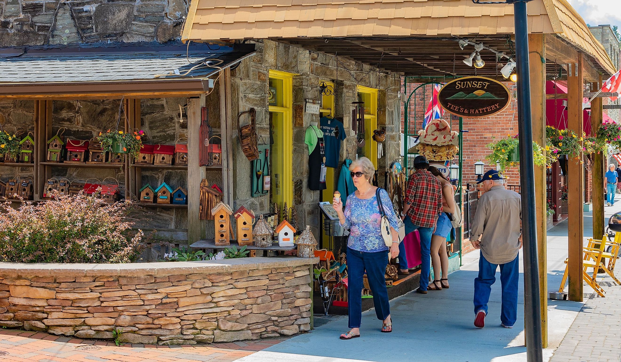 Tourists pass The Sunset Tee's & Hattery shop on Main St. in Blowing Rock, NC, USA. Editorial credit: J. Michael Jones / Shutterstock.com