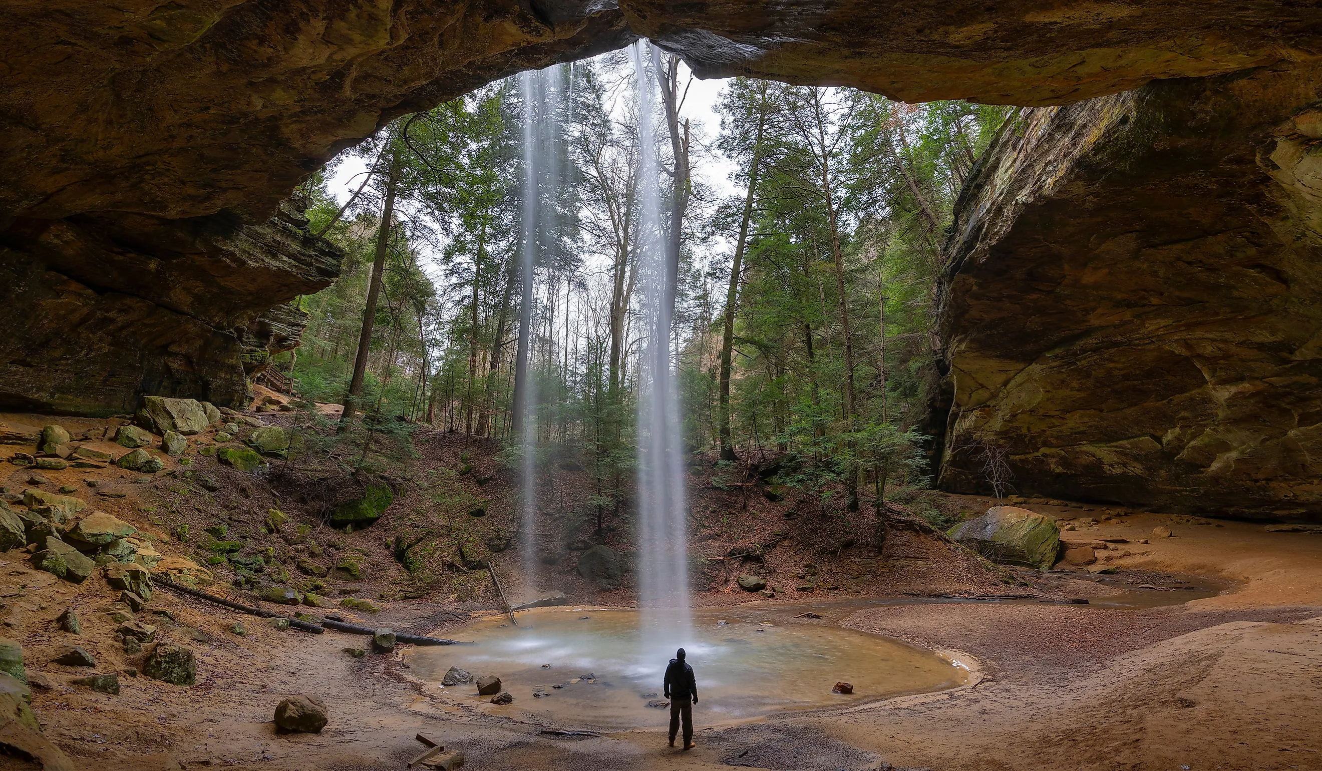 Hiker at Ash Cave in Hocking Hills, Ohio.