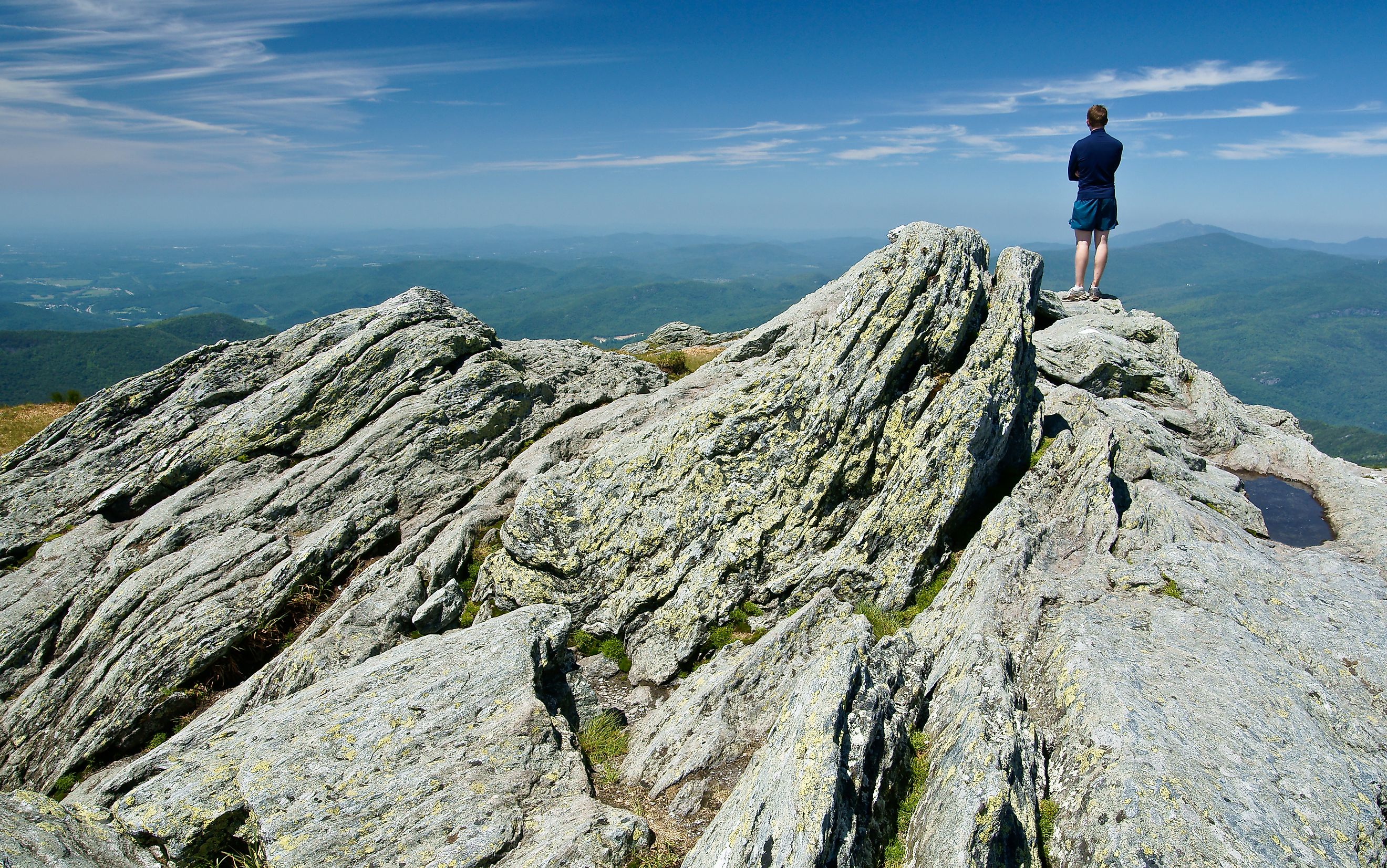 Hiker on Camels Hump in Vermont, which is part of the Long Trail.