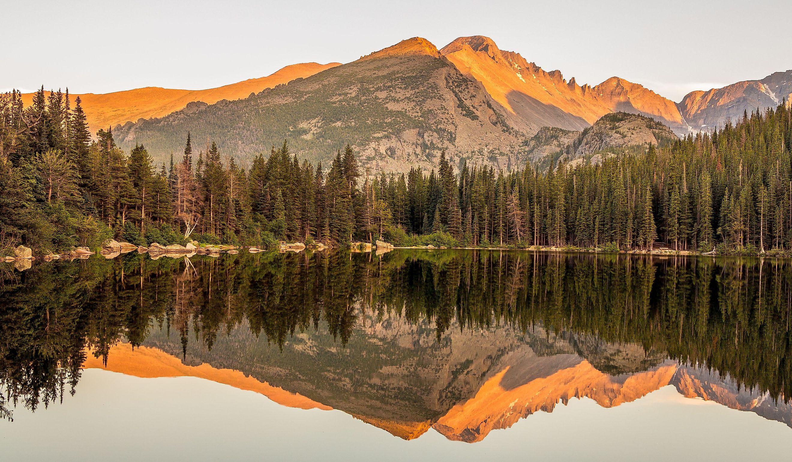 Sunset lake reflection of mountains at Bear Lake in Rocky Mountain National Park, Colorado. 