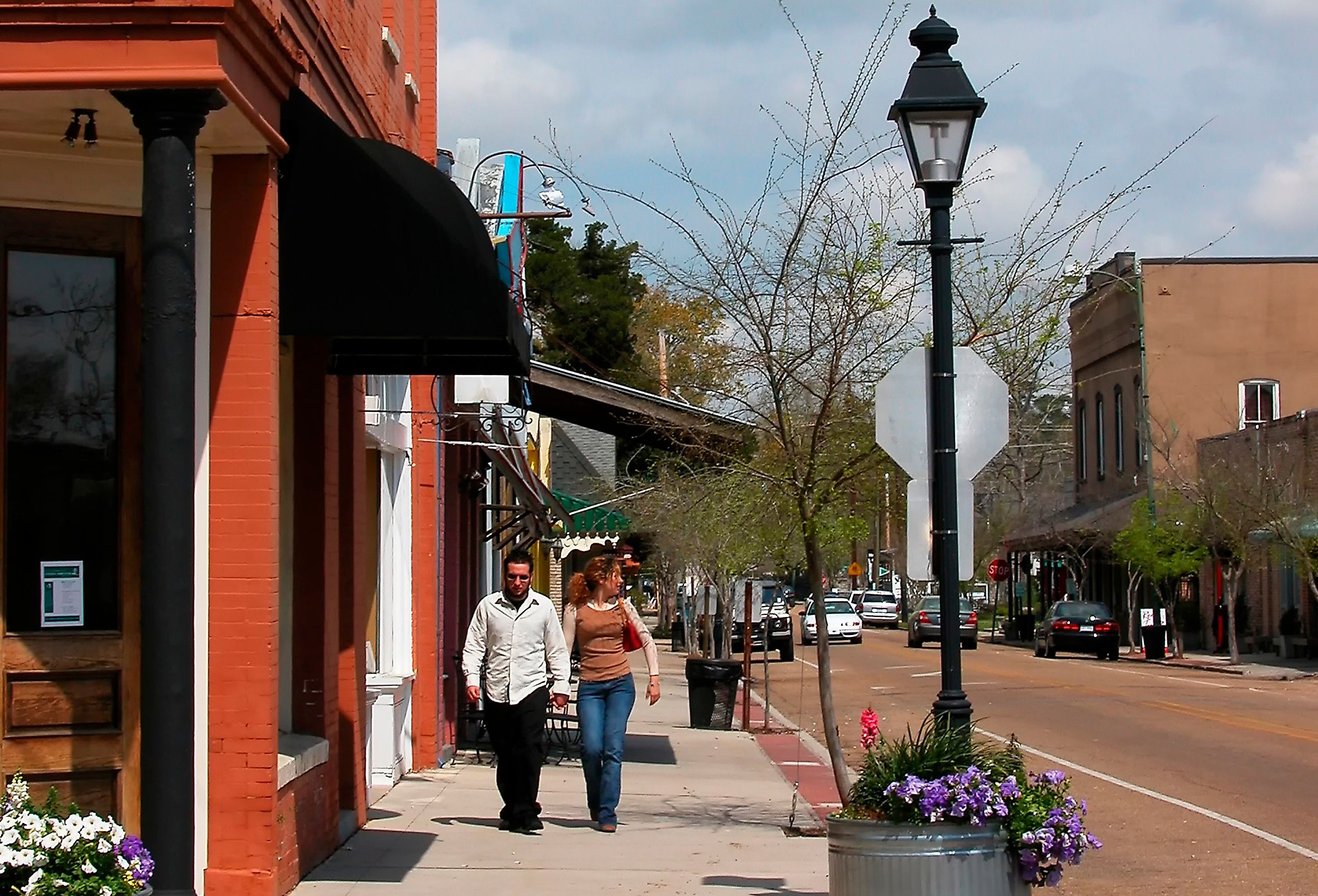 Couple strolling on Columbia Street in Covington, Louisiana. Image credit Malachi Jacobs via Shutterstock