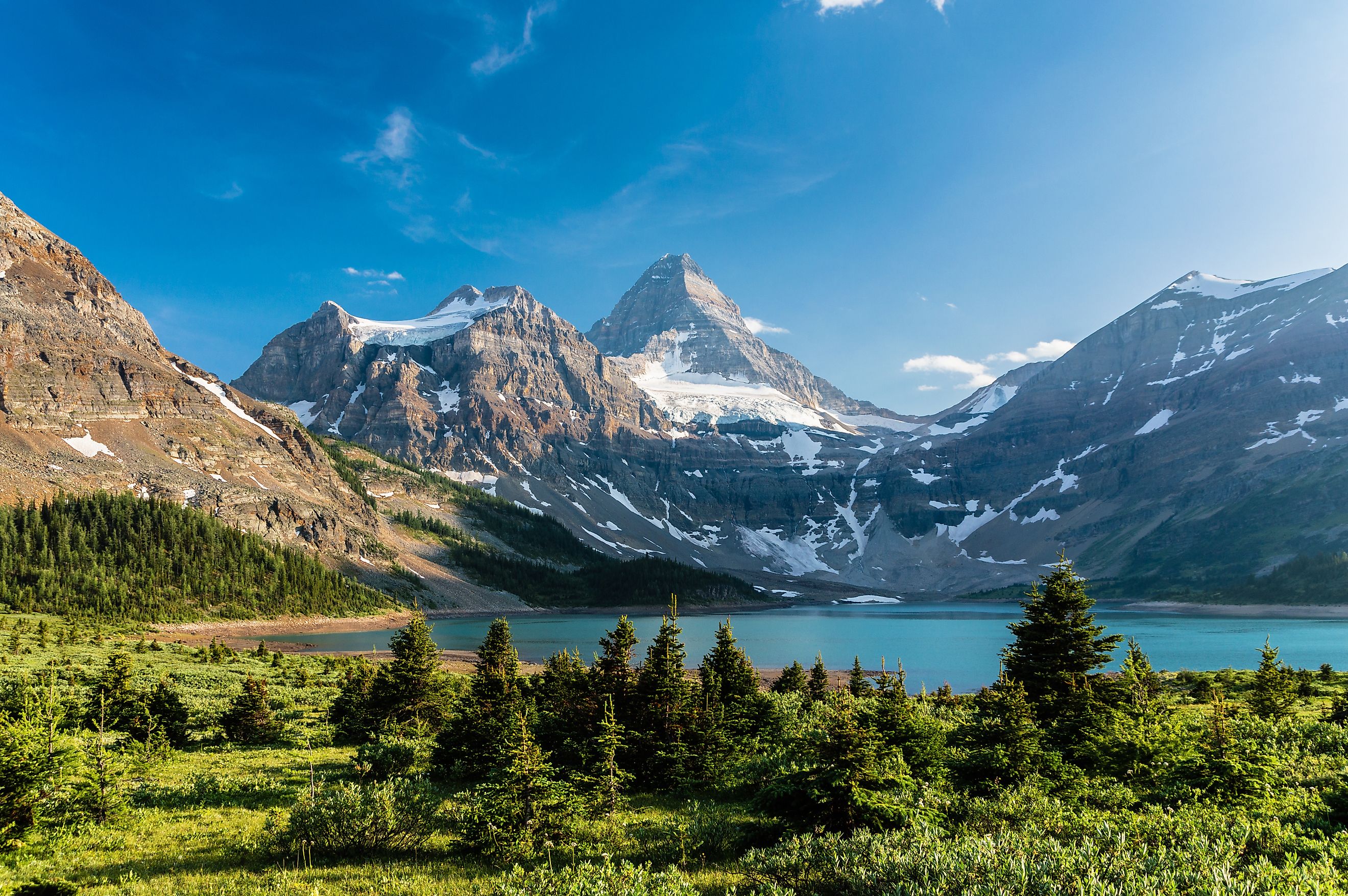 Mount Assiniboine is the pyramid-shaped peak at center, high above Lake Magog.