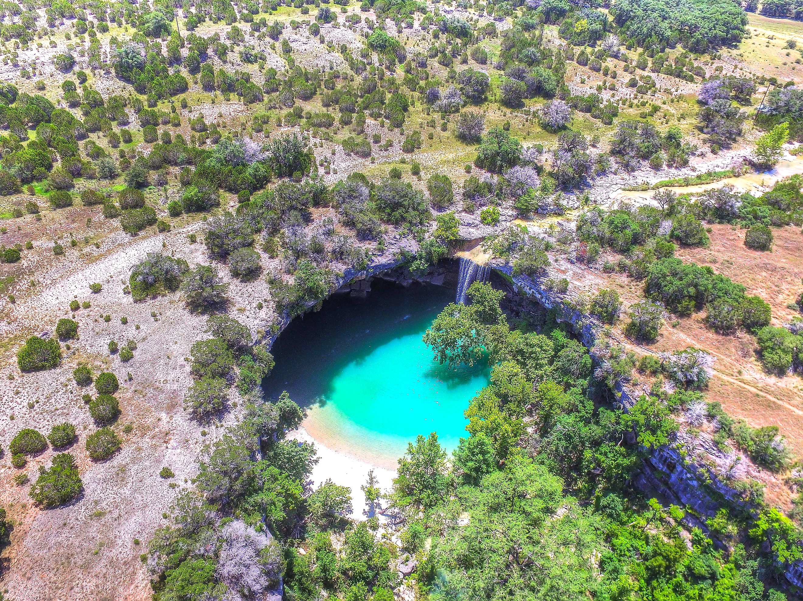 Aerial drone view of Hamilton Pool in Dripping Springs Texas.