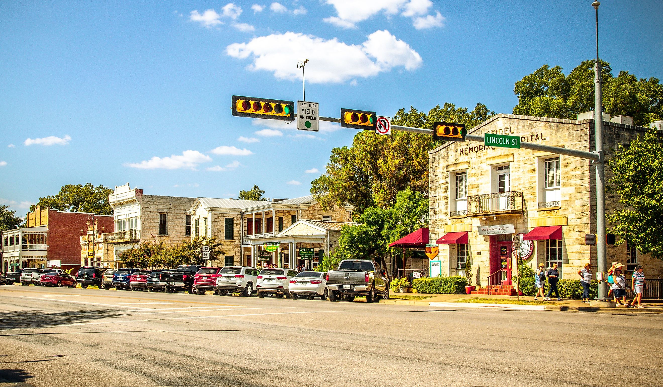 The Main Street in Fredericksburg, Texas, also known as "The Magic Mile," with retail stores and people walking. Editorial credit: ShengYing Lin / Shutterstock.com