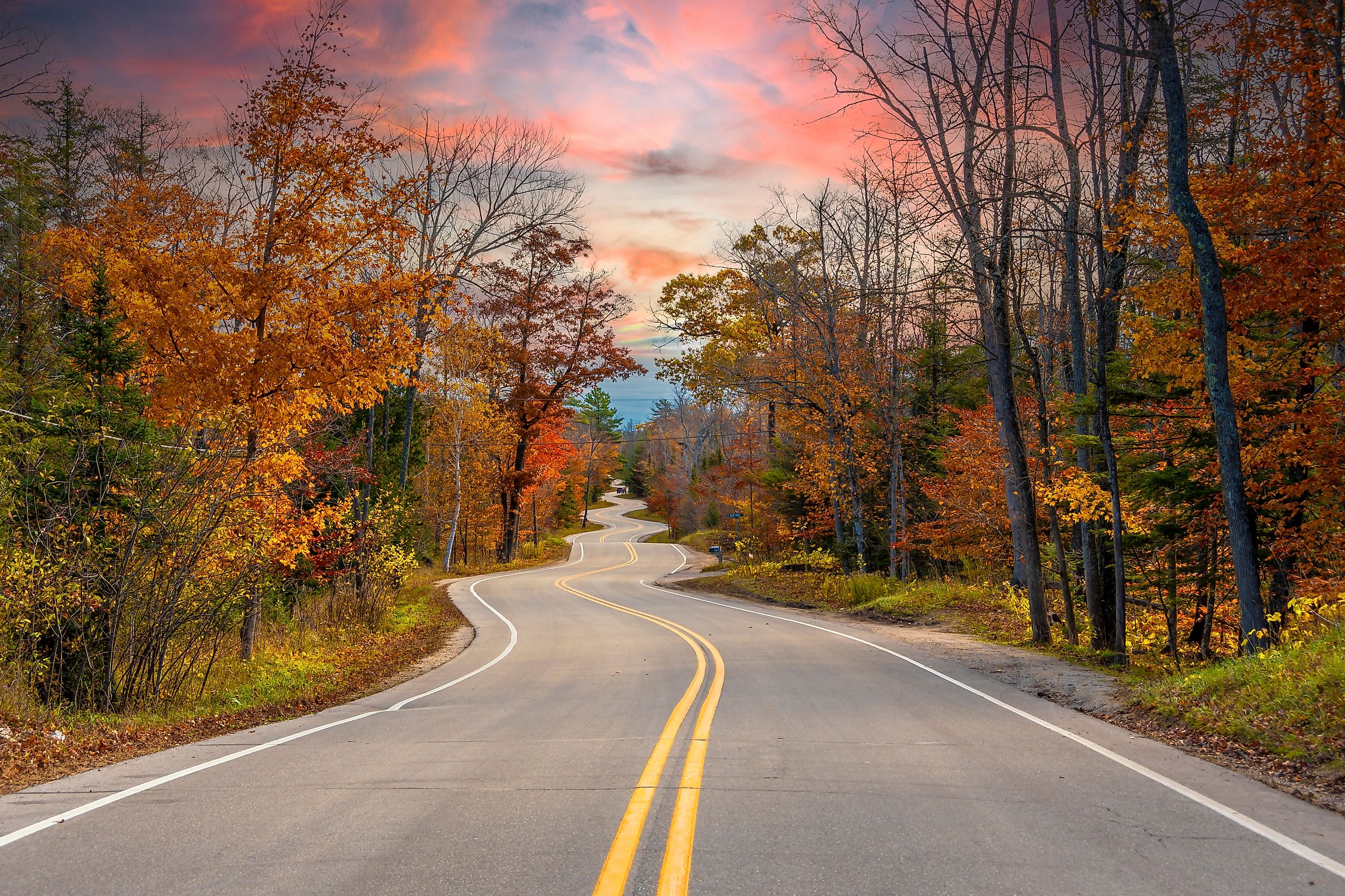 A winding road surrounded by fall foliage near Gills Rock in Door County, Wisconsin.