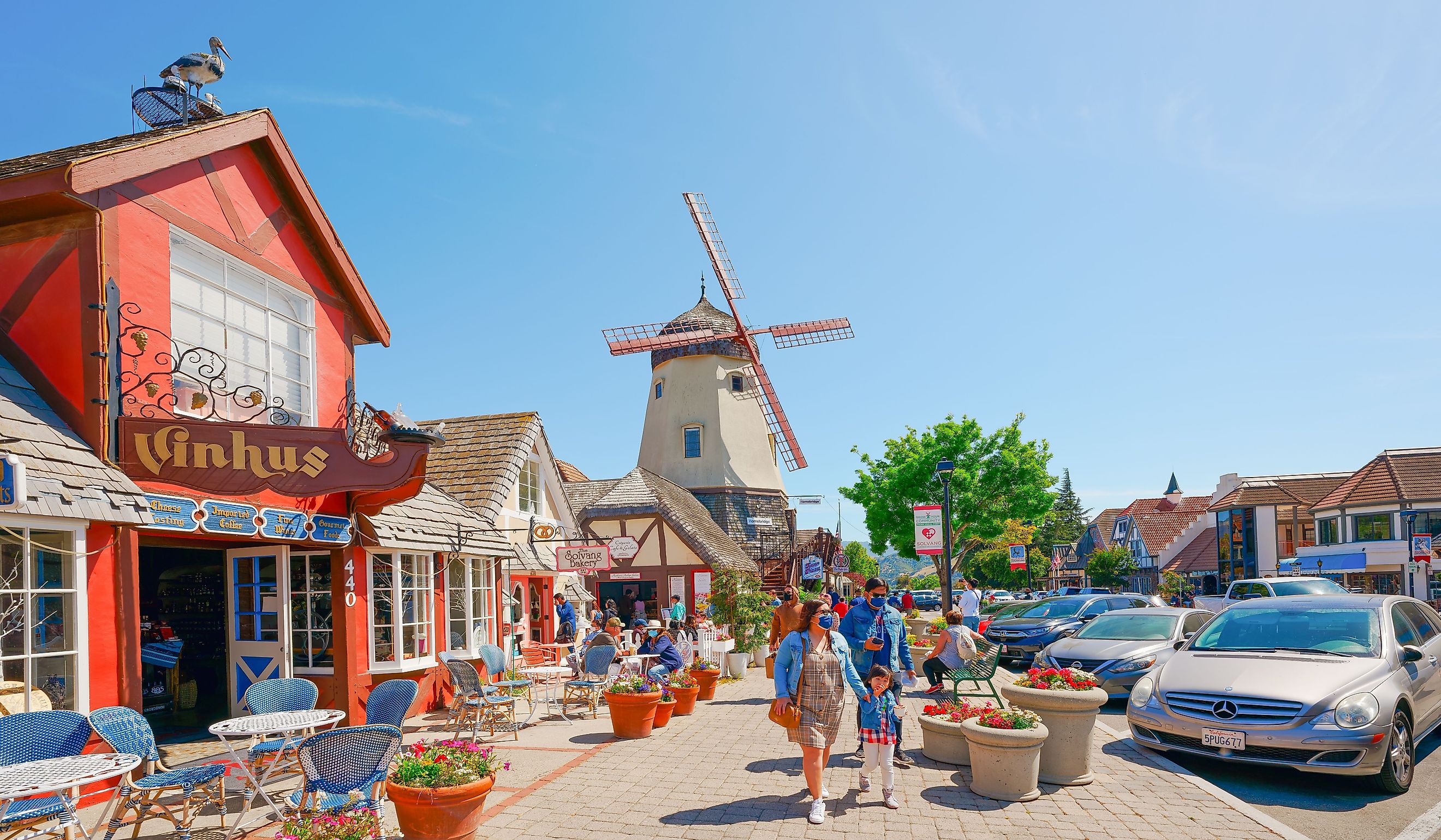 Main street, street view, and tourists in Solvang, beautiful small town in California, town has known for its traditional Danish style architecture. Editorial credit: HannaTor / Shutterstock.com