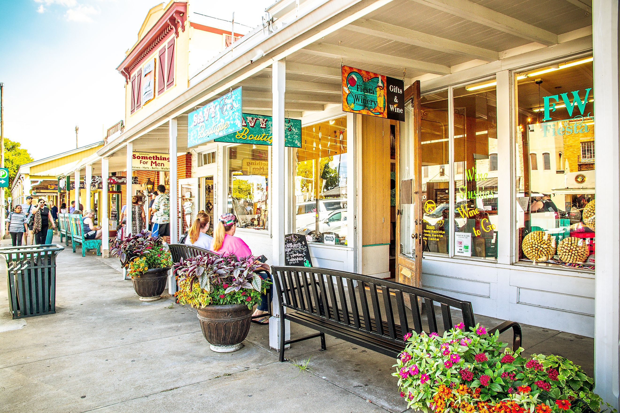 The Main Street in Frederiksburg, Texas, also known as "The Magic Mile", with retail stores and poeple, via ShengYing Lin / Shutterstock.com